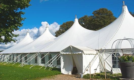 a row of portable restrooms placed outdoors for attendees of a event in Lyndhurst, NJ